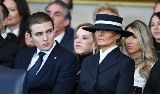 Barron Trump and First Lady Melania Trump listen as President Donald Trump delivers remarks after being sworn in as the 47th President in the U.S. Capitol Rotunda in Washington, D.C., on Jan. 20, 2025.