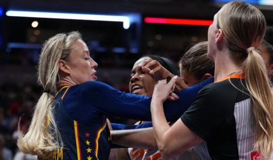 Sophie Cunningham of the Indiana Fever, left, and Jacy Sheldon of the Connecticut Sun, second from right, get into an altercation during the fourth quarter of game in Indianapolis, Indiana, on Tuesday.