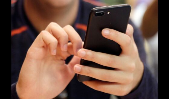 In this Friday, Sept. 16, 2017, file photo, a person uses a smart phone in Chicago.